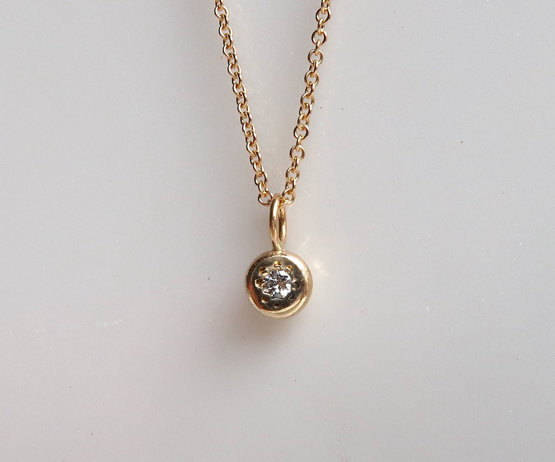 Diamond yellow gold disc necklace