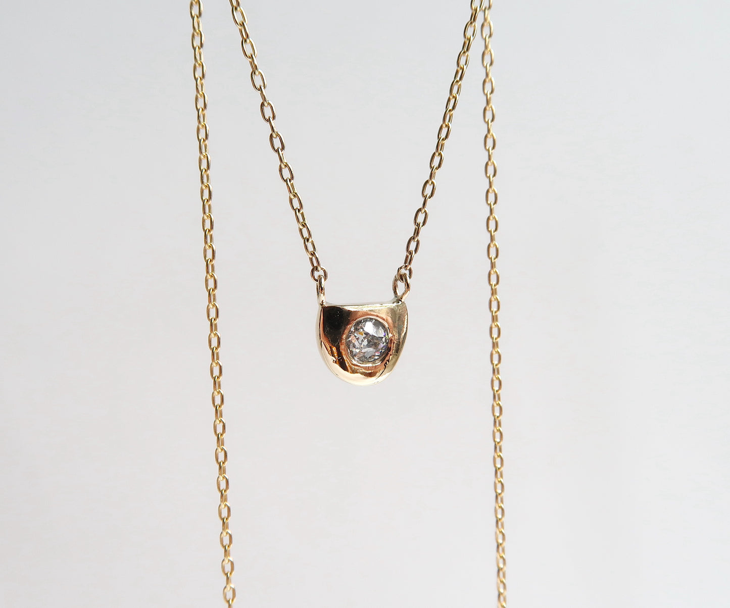 Nishi diamond half moon gold frame necklace