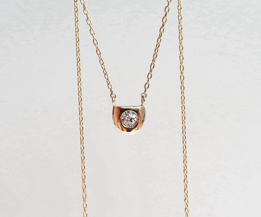 Nishi diamond half moon gold frame necklace