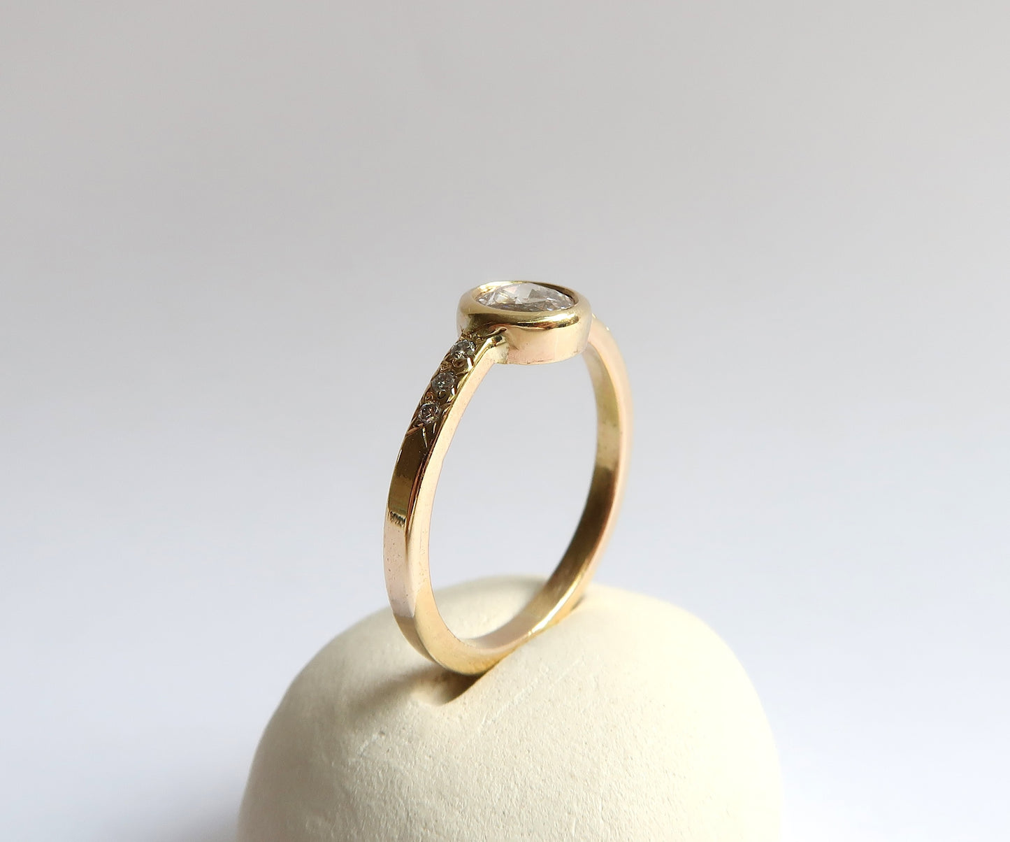 Bezel set rose cut diamond ring in yellow gold