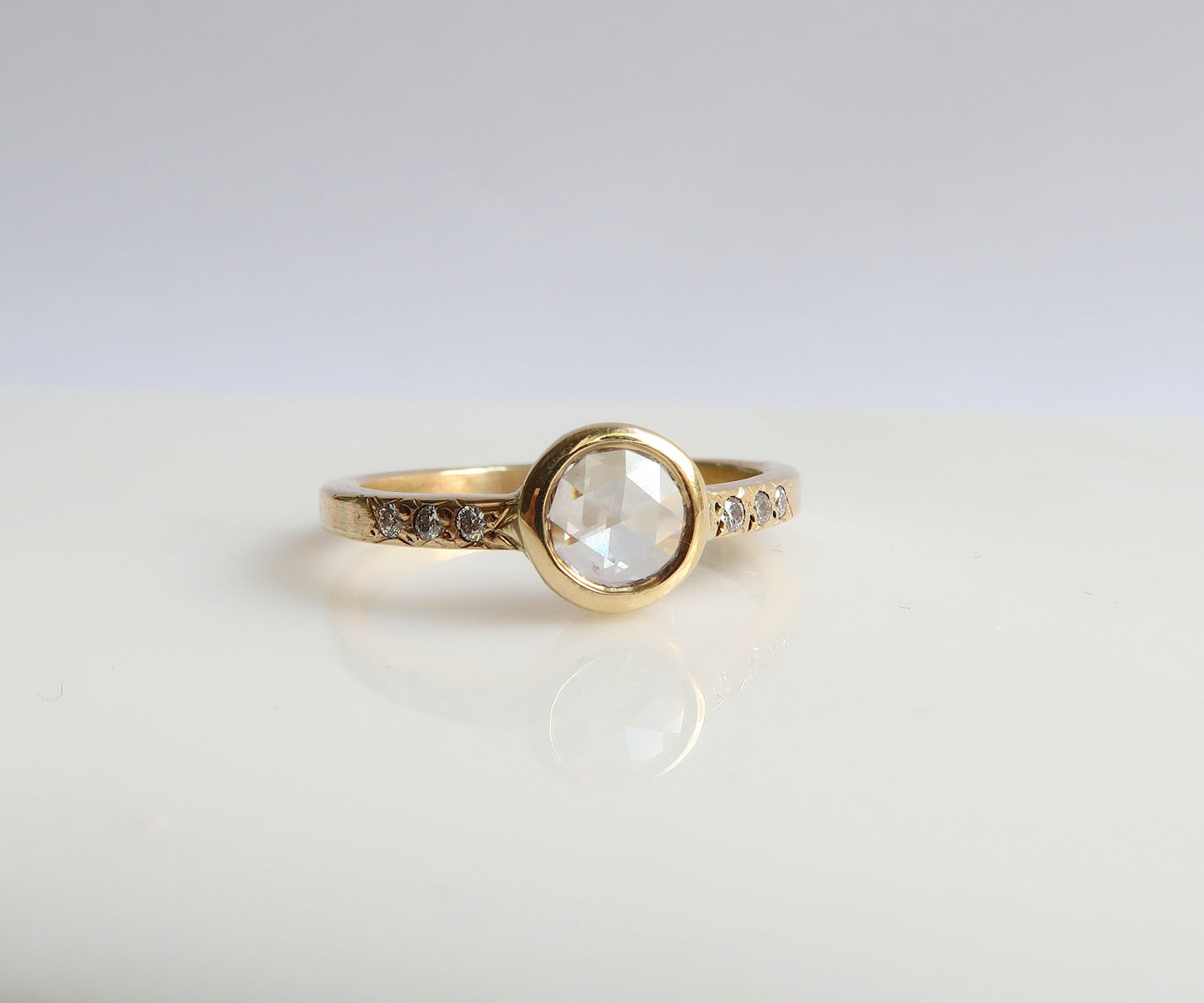 Bezel set rose cut diamond ring in yellow gold