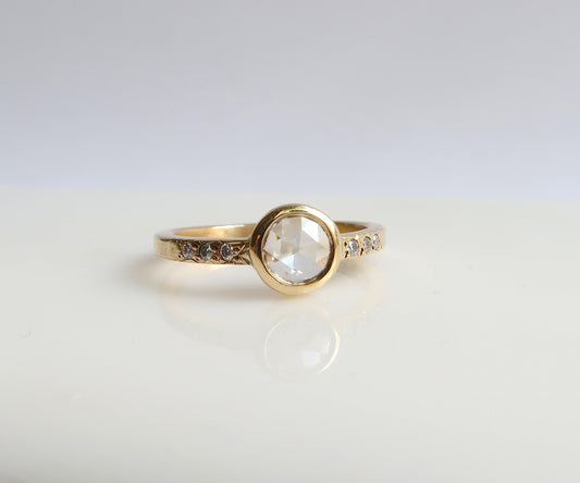 Bezel set rose cut diamond ring in yellow gold