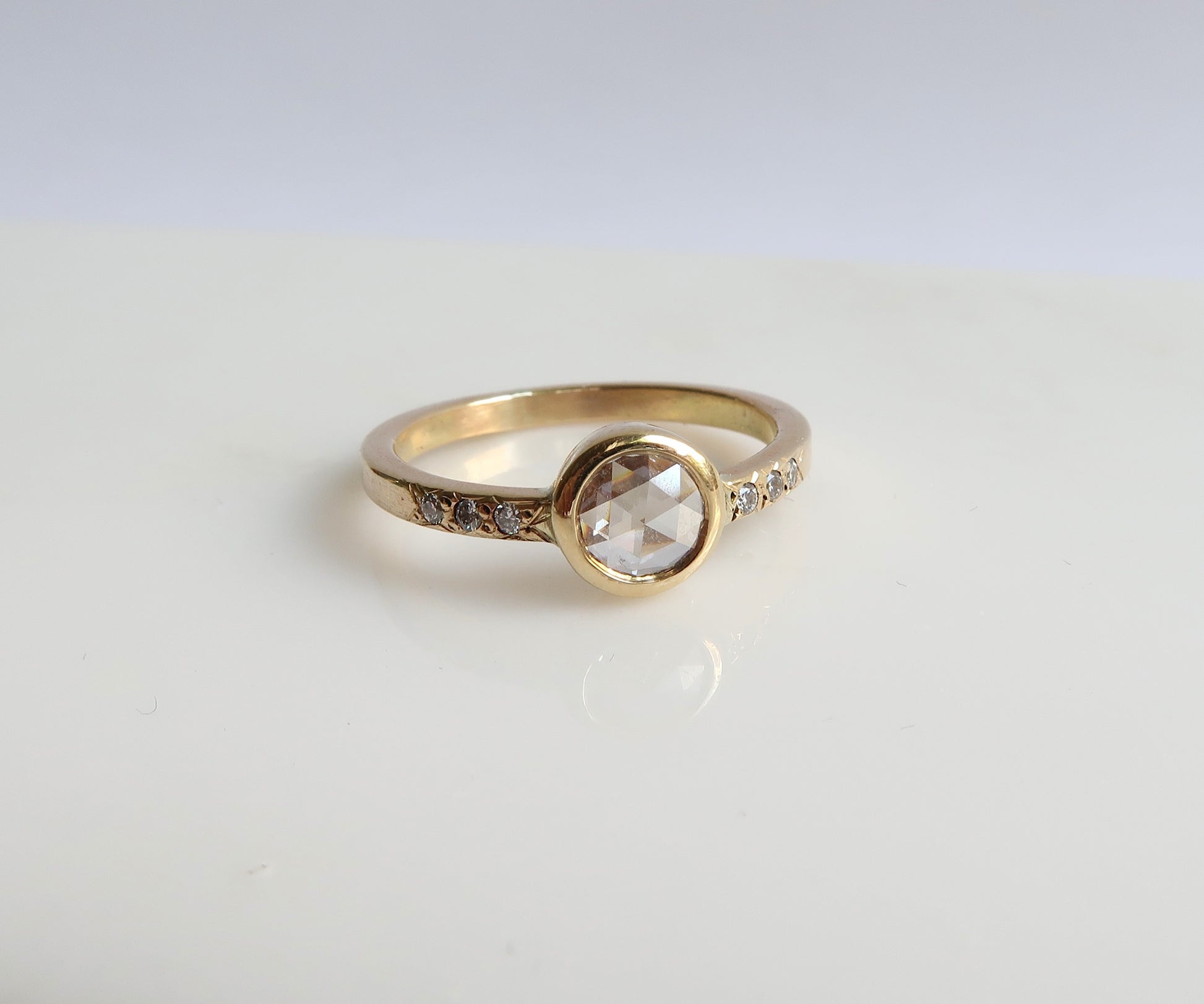 Bezel set rose cut diamond ring in yellow gold