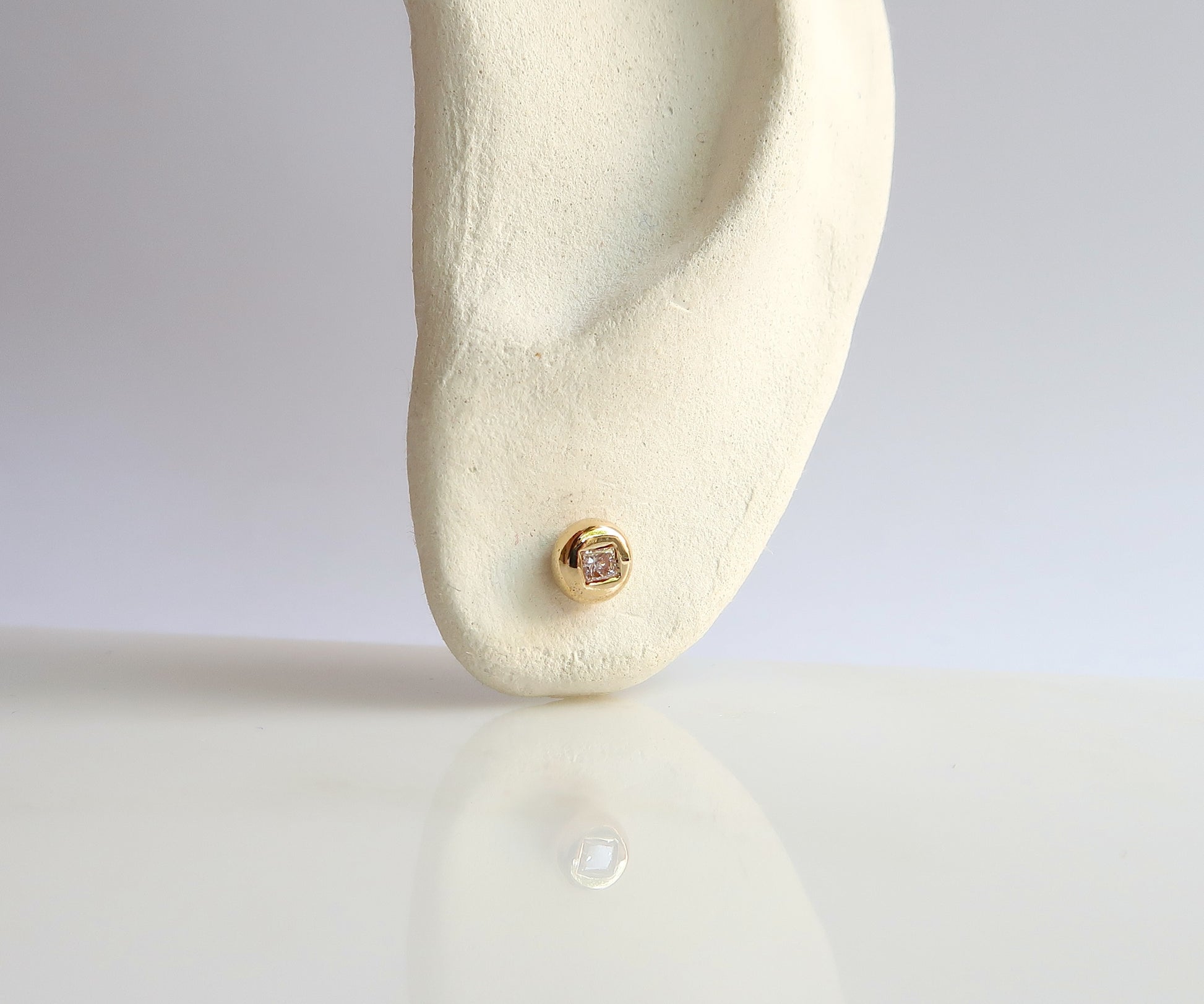 Round Diamond Studs with Square Cut Diamonds