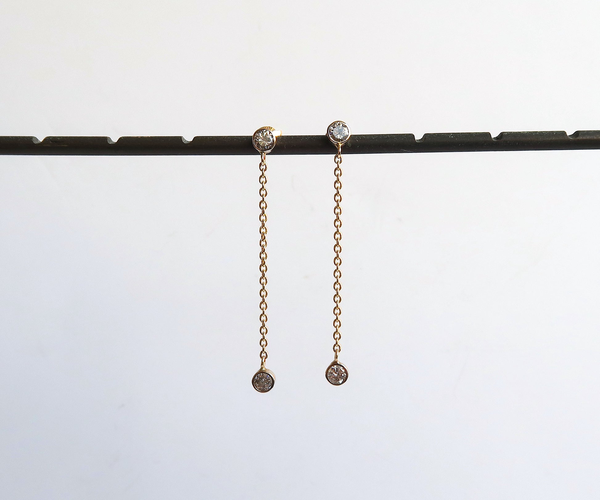 Nishi bezel set diamond chain link earrings