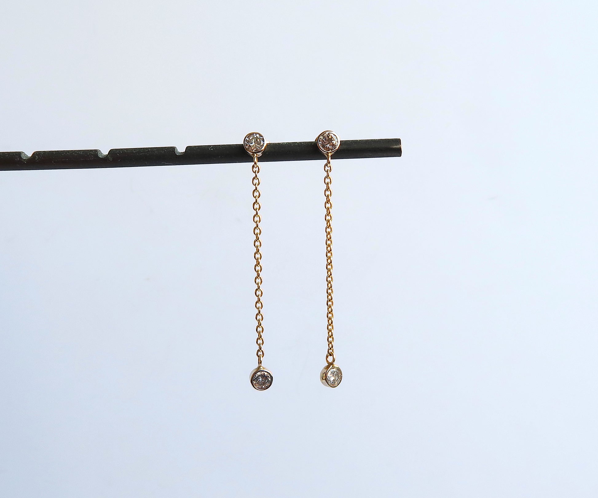 Nishi bezel set diamond chain link earrings