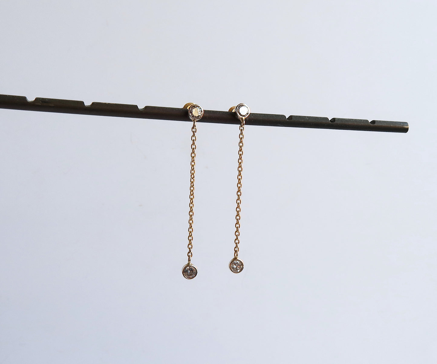 Nishi bezel set diamond chain link earrings