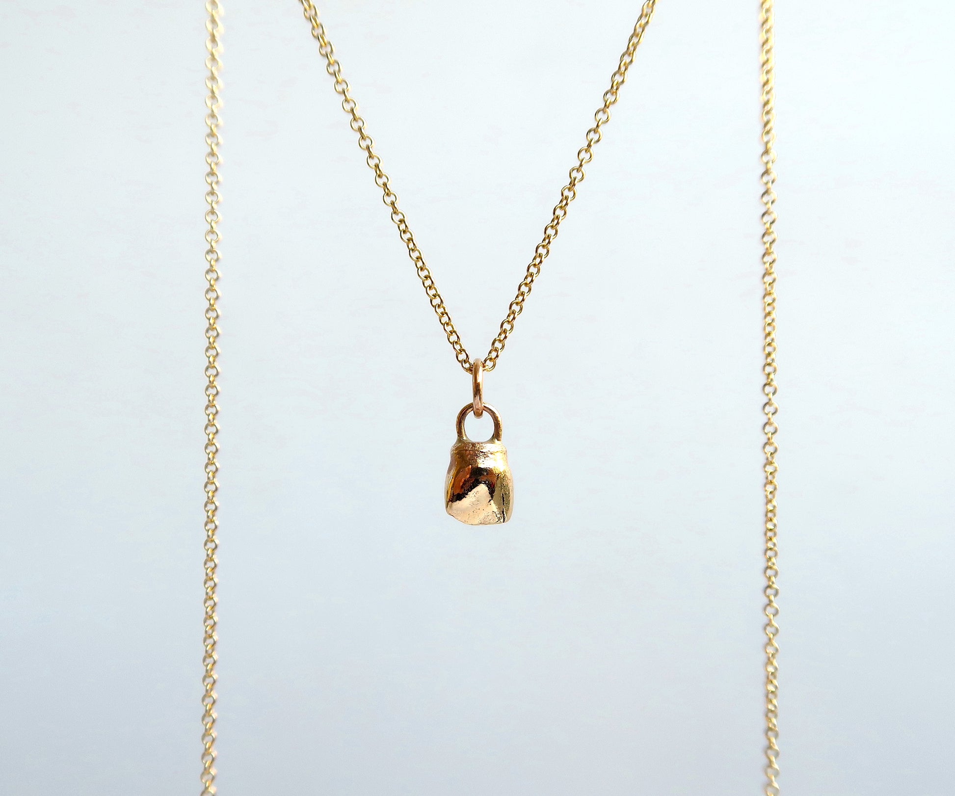 Nishi baby tooth necklace