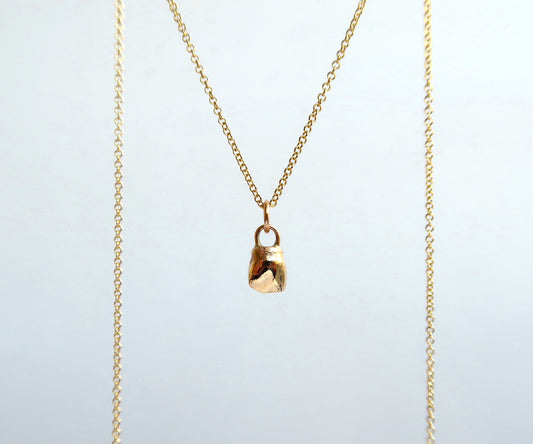 Nishi baby tooth necklace