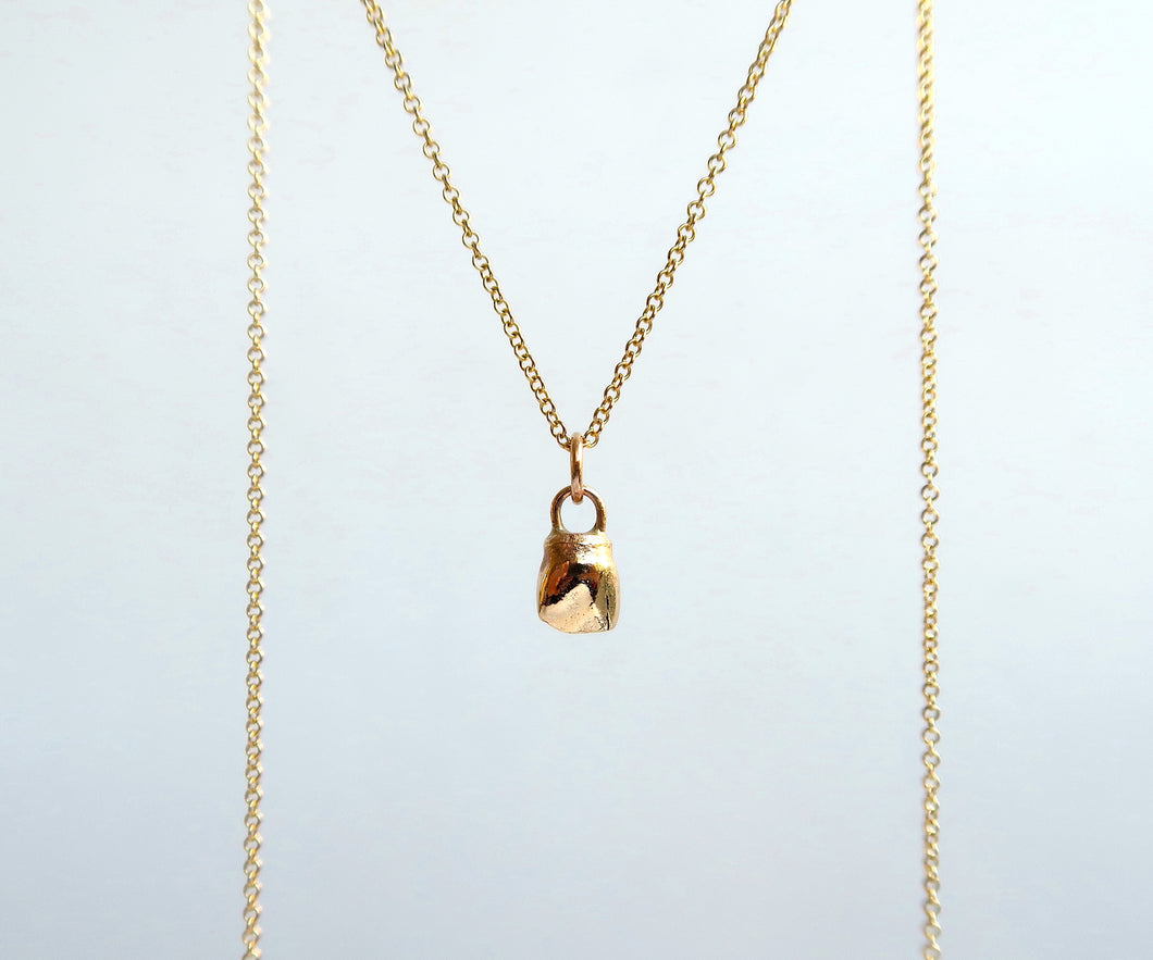 Nishi baby tooth necklace
